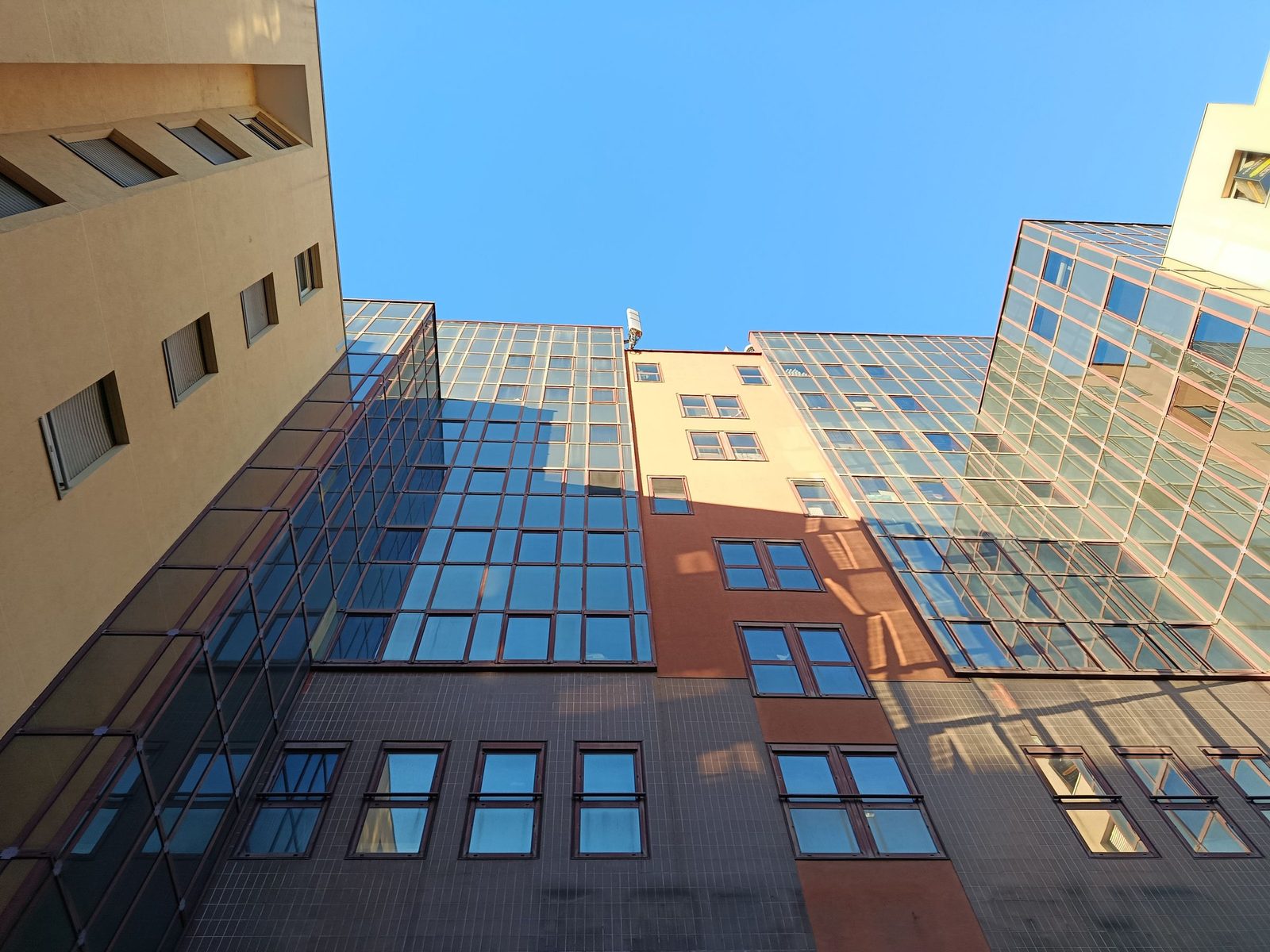 Sunlit glass-and-concrete commercial facade