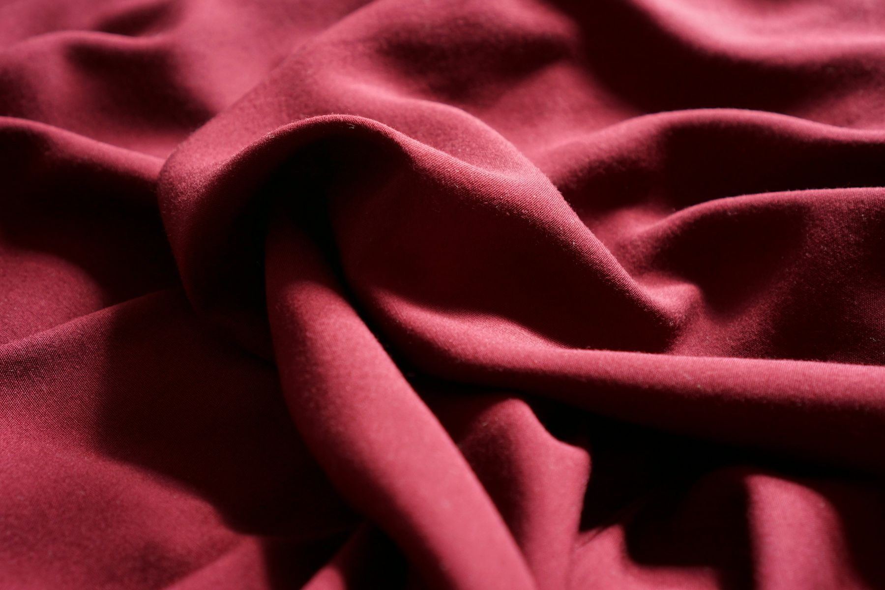 Close-up of folded maroon fabric